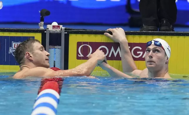 Jack Aikins and Ryan Murphy after a Men's 200 backstroke semifinal heat Wednesday, June 19, 2024, at the US Swimming Olympic Trials in Indianapolis. (AP Photo/Michael Conroy)