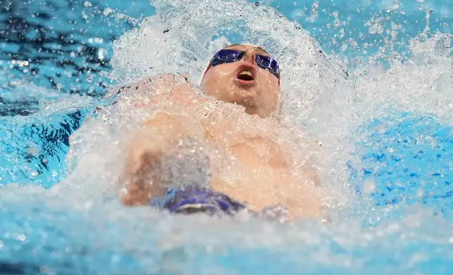 Jack Aikins swims during a Men's 200 backstroke semifinal heat Wednesday, June 19, 2024, at the US Swimming Olympic Trials in Indianapolis. (AP Photo/Michael Conroy)