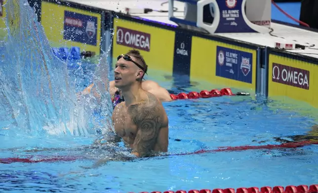 Caeleb Dressel reacts after winning the Men's 100 butterfly finals Saturday, June 22, 2024, at the US Swimming Olympic Trials in Indianapolis. (AP Photo/Darron Cummings)