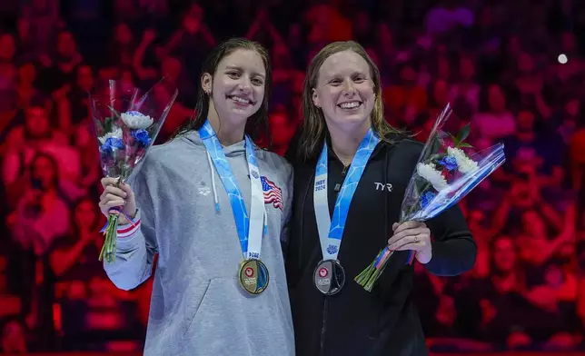 Lilly King and Kate Douglass celebrate after the Women's 200 breaststroke finals Thursday, June 20, 2024, at the US Swimming Olympic Trials in Indianapolis. (AP Photo/Darron Cummings)