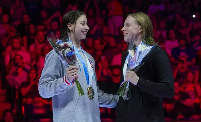 Lilly King and Kate Douglass celebrate after the Women's 200 breaststroke finals Thursday, June 20, 2024, at the US Swimming Olympic Trials in Indianapolis. (AP Photo/Darron Cummings)