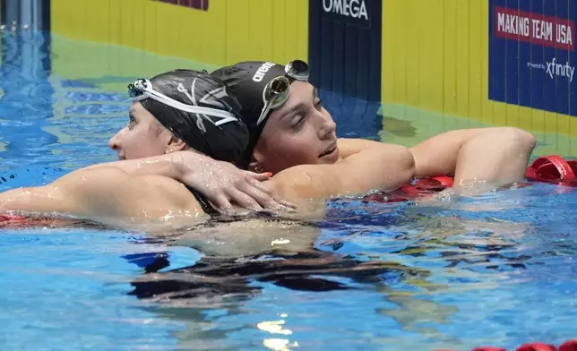 Kate Douglass and Alex Walsh celebrate after the Women's 200 individual medley finals Saturday, June 22, 2024, at the US Swimming Olympic Trials in Indianapolis. (AP Photo/Darron Cummings)