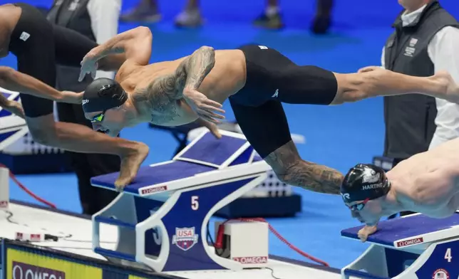 Caeleb Dressel swims during the Men's 100 butterfly finals Saturday, June 22, 2024, at the US Swimming Olympic Trials in Indianapolis. (AP Photo/Darron Cummings)