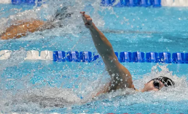 Kate Douglass swims during the Women's 100 freestyle finals Wednesday, June 19, 2024, at the US Swimming Olympic Trials in Indianapolis. (AP Photo/Darron Cummings)