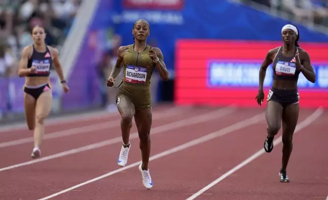 Sha'Carri Richardson wins a heat in the women's 200-meter run during the U.S. Track and Field Olympic Team Trials Thursday, June 27, 2024, in Eugene, Ore. (AP Photo/Charlie Neibergall)