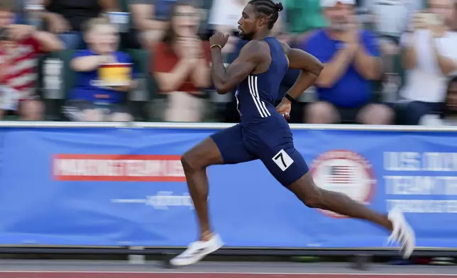 Noah Lyles wins a heat men's 200-meter semi-finals during the U.S. Track and Field Olympic Team Trials Friday, June 28, 2024, in Eugene, Ore. (AP Photo/Charlie Neibergall)