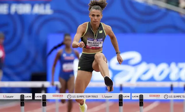 Sydney McLaughlin-Levrone wins a heat in the women's 400-meter hurdles during the U.S. Track and Field Olympic Team Trials Thursday, June 27, 2024, in Eugene, Ore. (AP Photo/Charlie Neibergall)