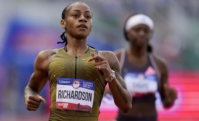 Sha'Carri Richardson wins a heat in the women's 200-meter run during the U.S. Track and Field Olympic Team Trials Thursday, June 27, 2024, in Eugene, Ore. (AP Photo/Charlie Neibergall)