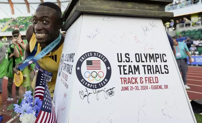 Grant Holloway celebrates after winning the men's 110-meter hurdles final during the U.S. Track and Field Olympic Team Trials Friday, June 28, 2024, in Eugene, Ore. (AP Photo/George Walker IV)