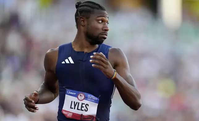 Noah Lyles wins a heat men's 200-meter semi-finals during the U.S. Track and Field Olympic Team Trials Friday, June 28, 2024, in Eugene, Ore. (AP Photo/George Walker IV)