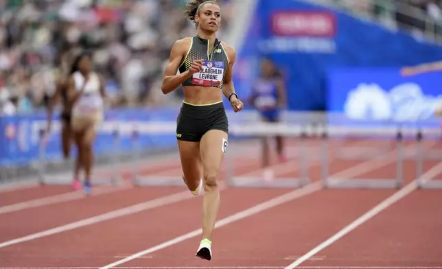 Sydney McLaughlin-Levrone wins a heat in the women's 400-meter hurdles during the U.S. Track and Field Olympic Team Trials Thursday, June 27, 2024, in Eugene, Ore. (AP Photo/Charlie Neibergall)
