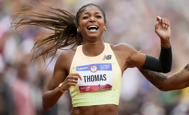 Gabby Thomas celebrates after winning the women's 200-meter final during the U.S. Track and Field Olympic Team Trials Saturday, June 29, 2024, in Eugene, Ore. (AP Photo/Charlie Neibergall)