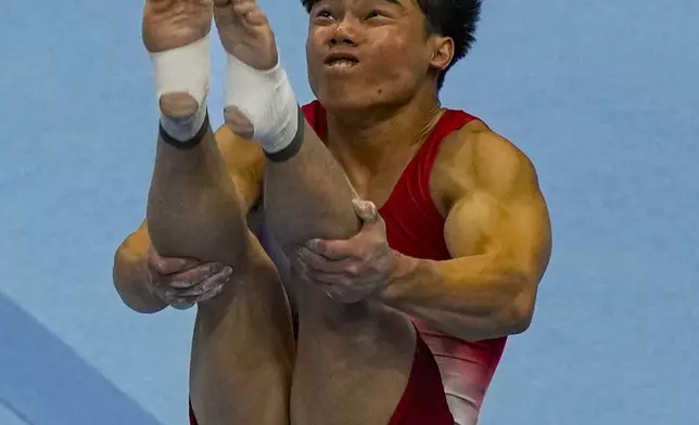 Asher Hong competes in the floor exercise at the United States Gymnastics Olympic Trials on Thursday, June 27, 2024, in Minneapolis. (AP Photo/Charlie Riedel)
