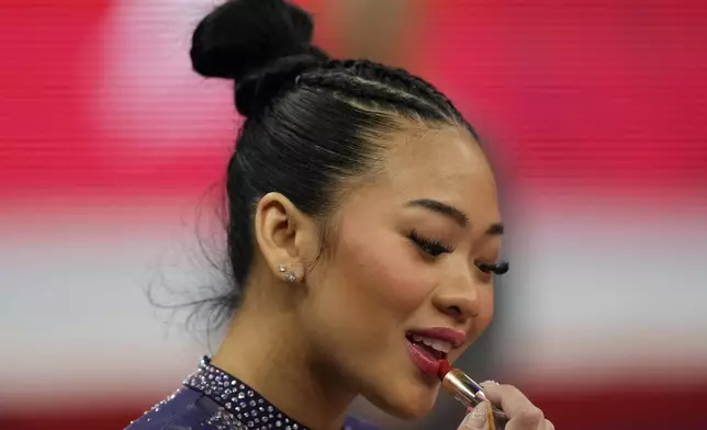 Suni Lee prepares for competition at the United States Gymnastics Olympic Trials on Friday, June 28, 2024 in Minneapolis. (AP Photo/Charlie Riedel)