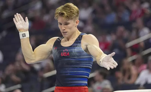 Shane Wiskus celebrates after competing on the pommel horse at the United States Gymnastics Olympic Trials on Thursday, June 27, 2024, in Minneapolis. (AP Photo/Abbie Parr)