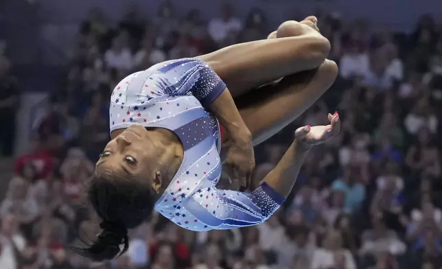 Simone Biles competes in the floor exercise at the United States Gymnastics Olympic Trials on Friday, June 28, 2024, in Minneapolis. (AP Photo/Charlie Riedel)