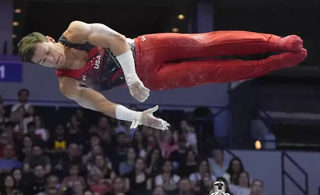 Brody Malone competes on the horizontal bar at the United States Gymnastics Olympic Trials on Saturday, June 29, 2024, in Minneapolis. (AP Photo/Charlie Riedel)