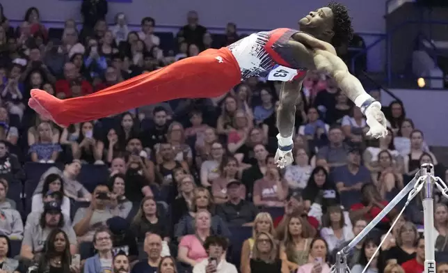 Frederick Richard competes on the horizontal bar at the United States Gymnastics Olympic Trials on Saturday, June 29, 2024, in Minneapolis. (AP Photo/Charlie Riedel)