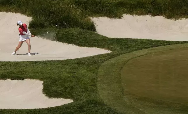 Hinako Shibuno, of Japan, hits out of the sand onto the 12th green during the third round of the U.S. Women's Open golf tournament at Lancaster Country Club, Saturday, June 1, 2024, in Lancaster, Pa. (AP Photo/Matt Slocum)