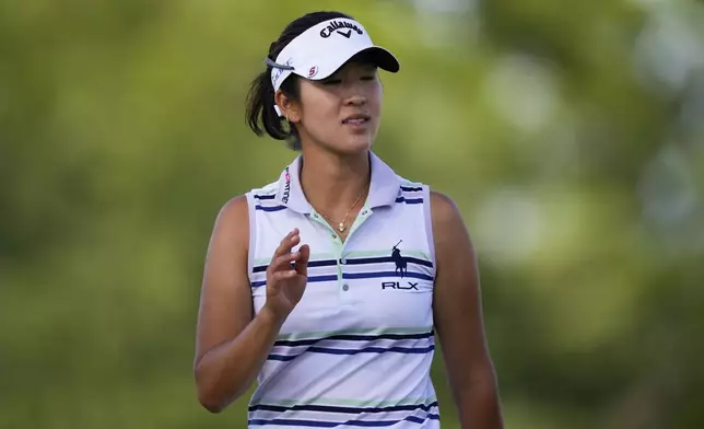 Andrea Lee waves after missing a putt on the 18th green during the third round of the U.S. Women's Open golf tournament at Lancaster Country Club, Saturday, June 1, 2024, in Lancaster, Pa. (AP Photo/Matt Slocum)