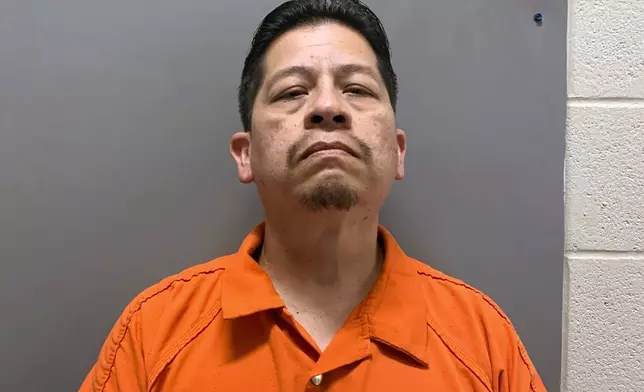 This booking image provided by Uvalde County, Texas, Sheriff's Office shows Adrian Gonzales, a former police officer for schools in Uvalde, Texas, who was arrested and booked into jail before he was released Friday, June 28, 2024, on 29 charges of abandoning or endangering a child in the May 24, 2022, attack that killed 19 children and two teachers. (Uvalde County Sheriff's Office via AP)