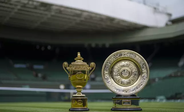 FILE - A view of the Venus Rosewater Dish - the Ladies' Singles Trophy, and the Gentlemen's Singles Trophy, during the presentation to the media, ahead of the Wimbledon Tennis Championships, in London, Saturday June 26, 2021. This year's Wimbledon tournament begins on Monday, July 1. (Thomas Lovelock/Pool via AP, File)