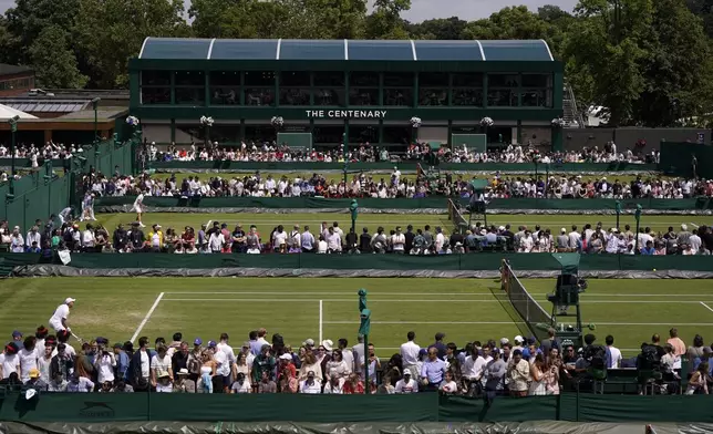 FILE - Play takes place on the outside courts on day four of the Wimbledon tennis championships in London, Thursday, July 6, 2023. This year's Wimbledon tournament begins on Monday, July 1.(AP Photo/Alberto Pezzali, File)