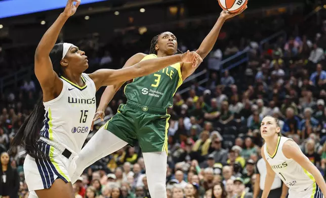 Seattle Storm's Nneka Ogwumike makes a move around Dallas center Teaira McCowan for a shot during the first quarter of a WNBA basketball game Saturday, June 29, 2024, in Seattle. (Dean Rutz/The Seattle Times via AP)