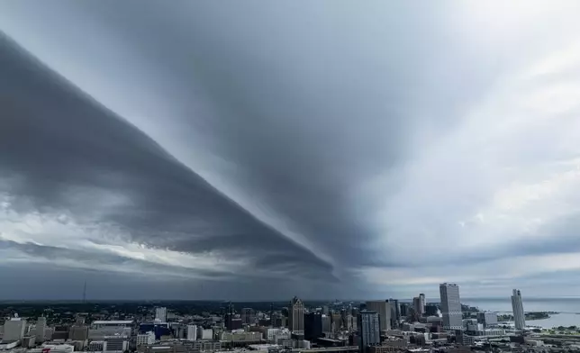 A shelf cloud moves into downtown Milwaukee, Sunday, June 16, 2024. (AP Photo/Jeffrey Phelps)