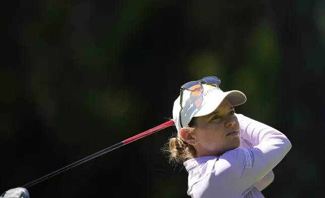 Sarah Schmelzel watches her shot after hitting from the 15th tee during the second round of the Women's PGA Championship golf tournament at Sahalee Country Club, Friday, June 21, 2024, in Sammamish, Wash. (AP Photo/Lindsey Wasson)