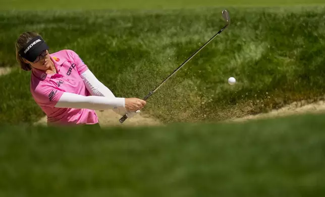 Brooke M. Henderson, of Canada, shoots out of a bunker on the 18th hole during a practice round for the Womens PGA Championship golf tournament at Sahalee Country Club, Wednesday, June 19, 2024, in Sammamish, Wash. (AP Photo/Lindsey Wasson)
