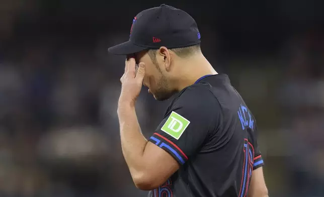Toronto Blue Jays pitcher Yusei Kikuchi reacts during the second inning of the team's baseball game against the New York Yankees on Friday, June 28, 2024, in Toronto. (Chris Young/The Canadian Press via AP)