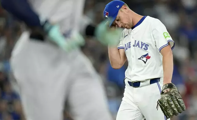 Toronto Blue Jays pitcher Chris Bassitt (40) reacts as New York Yankees' Aaron Judge (99) runs the bases during the first inning of a baseball game in Toronto, Saturday, June 29, 2024. (Frank Gunn/The Canadian Press via AP)