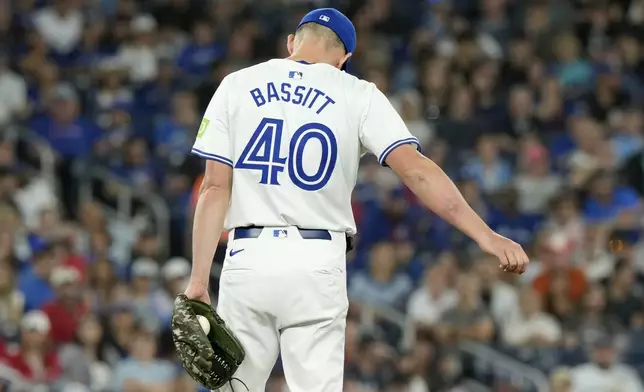 Toronto Blue Jays pitcher Chris Bassitt (40) sports a mark on his right arm where a line drive off the bat of New York Yankees' Aaron Judge (99) hit him during the first inning of a baseball game in Toronto, Saturday, June 29, 2024. (Frank Gunn/The Canadian Press via AP)