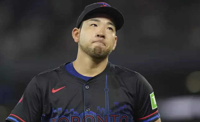 Toronto Blue Jays pitcher Yusei Kikuchi reacts after giving up a single to New York Yankees' Aaron Judge during the fourth inning of a baseball game Friday, June 28, 2024, in Toronto. (Chris Young/The Canadian Press via AP)