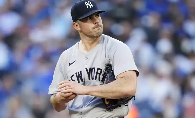 New York Yankees pitcher Carlos Rodon reacts on the mound against the Toronto Blue Jays during the first inning of a baseball game in Toronto on Thursday, June 27, 2024. (Frank Gunn/The Canadian Press via AP)