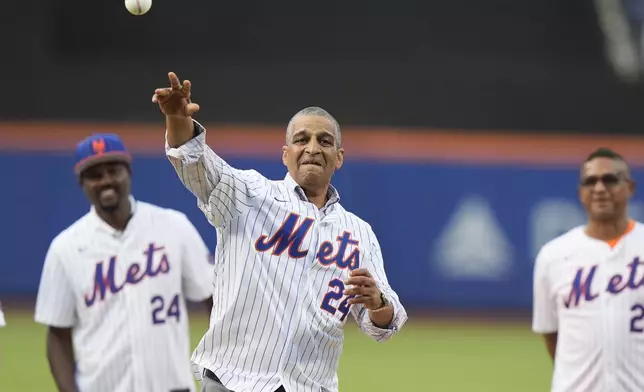 Willie Mays' son, Michael Mays, throws out a ceremonial first pitch before a baseball game between the New York Mets and the New York Yankees, Wednesday, June 26, 2024, in New York. (AP Photo/Frank Franklin II)