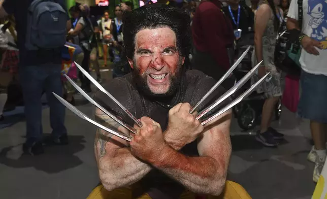 A fan dressed as Wolverine poses at Comic-Con International on Thursday, July 25, 2024, in San Diego. (Photo by Richard Shotwell/Invision/AP)