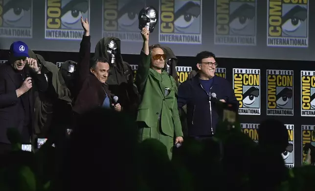 Kevin Feige, from left, Joe Russo, Robert Downey Jr., and Anthony Russo attend a panel for Marvel Studios during Comic-Con International on Saturday, July 27, 2024, in San Diego. (Photo by Richard Shotwell/Invision/AP)