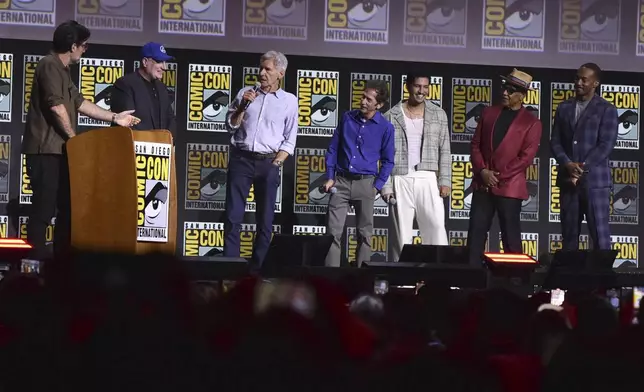 Rob Delaney, from left, Kevin Feige, Harrison Ford, Tim Blake Nelson, Danny Ramirez, Giancarlo Esposito, and Anthony Mackie attend a panel for Marvel Studios during Comic-Con International on Saturday, July 27, 2024, in San Diego. (Photo by Richard Shotwell/Invision/AP)