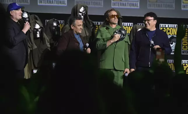 Kevin Feige, from left, Joe Russo, Robert Downey Jr., and Anthony Russo attend a panel for Marvel Studios during Comic-Con International on Saturday, July 27, 2024, in San Diego. (Photo by Richard Shotwell/Invision/AP)