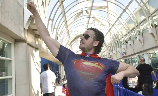 Chris Perry dressed as Superman attends preview night at Comic-Con International on Wednesday, July 24, 2024, in San Diego. (Photo by Richard Shotwell/Invision/AP)