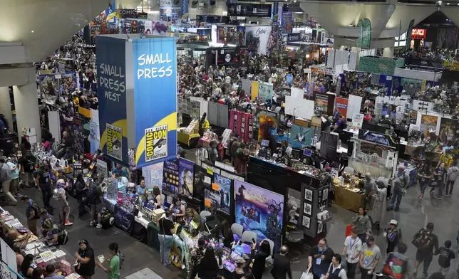 Crowds walk the convention floor during preview night for Comic-Con International, Wednesday, July 24, 2024, in San Diego. (AP Photo/Chris Pizzello)