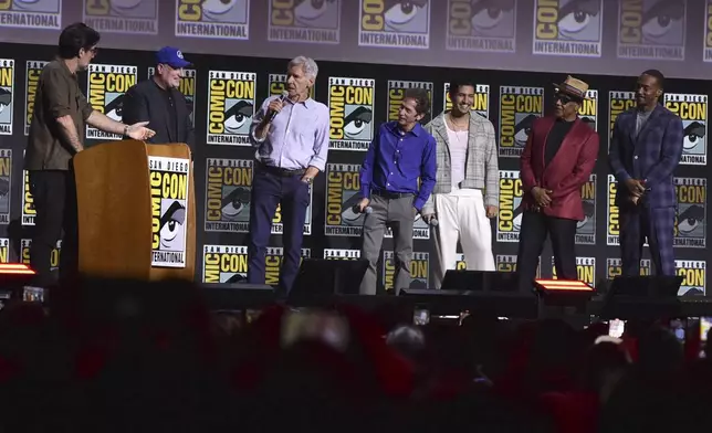 Rob Delaney, from left, Kevin Feige, Harrison Ford, Tim Blake Nelson, Danny Ramirez, Giancarlo Esposito, and Anthony Mackie attend a panel for "Marvel Studios" during Comic-Con International on Saturday, July 27, 2024, in San Diego. (Photo by Richard Shotwell/Invision/AP)