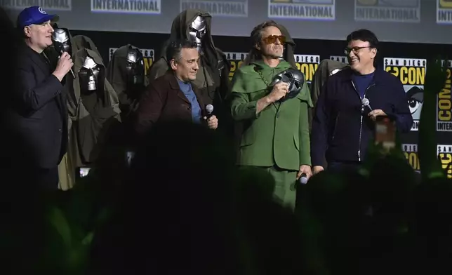 Kevin Feige, from left, Joe Russo, Robert Downey Jr., and Anthony Russo attend a panel for "Marvel Studios" during Comic-Con International on Saturday, July 27, 2024, in San Diego. (Photo by Richard Shotwell/Invision/AP)