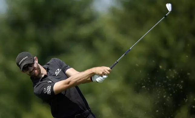 Patrick Rodgers hits off the tee on the fourth hole during the first round of the 3M Open golf tournament at the Tournament Players Club, Thursday, July 25, 2024, in Blaine, Minn. (AP Photo/Charlie Neibergall)