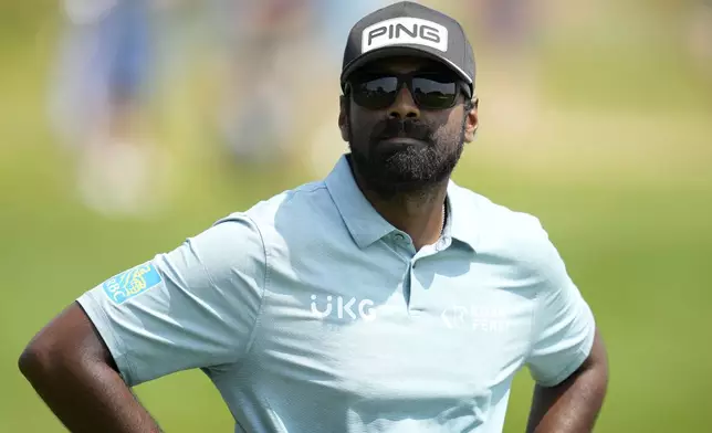 Sahith Theegala waits to hit on the fairway on the seventh hole during the final round of the 3M Open golf tournament at the Tournament Players Club, Sunday, July 28, 2024, in Blaine, Minn. (AP Photo/Charlie Neibergall)