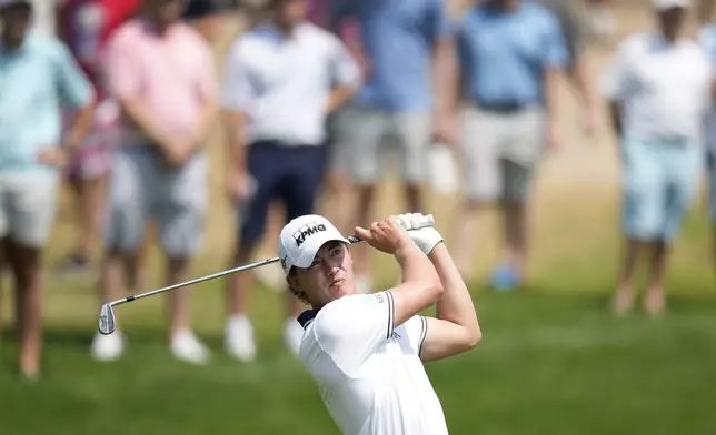 Maverick McNealy hits on the fairway on the seventh hole during the final round of the 3M Open golf tournament at the Tournament Players Club, Sunday, July 28, 2024, in Blaine, Minn. (AP Photo/Charlie Neibergall)