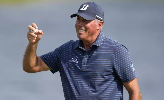 Matt Kuchar reacts after making his putt on the 18th green during the final round of the 3M Open golf tournament at the Tournament Players Club, Sunday, July 28, 2024, in Blaine, Minn. (AP Photo/Charlie Neibergall)