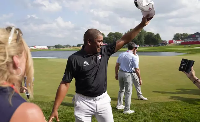 Jhonattan Vegas waves to fans after winning the 3M Open golf tournament at the Tournament Players Club, Sunday, July 28, 2024, in Blaine, Minn. (AP Photo/Charlie Neibergall)